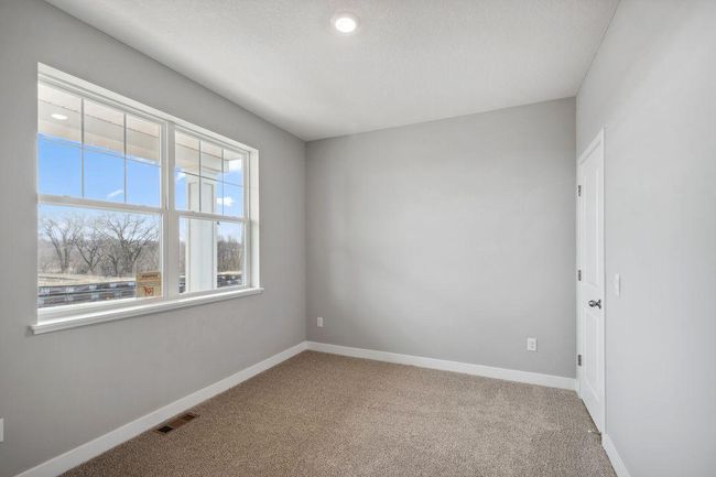 Desirable main floor bedroom with full bath. Model photo. Options and colors will vary. | Image 16