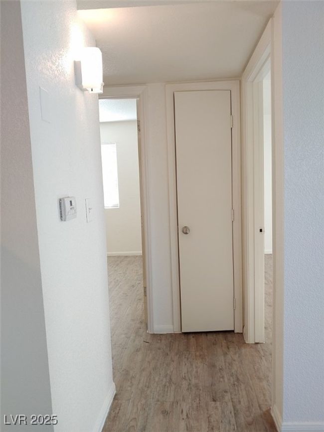 Hallway featuring light hardwood / wood-style flooring | Image 5