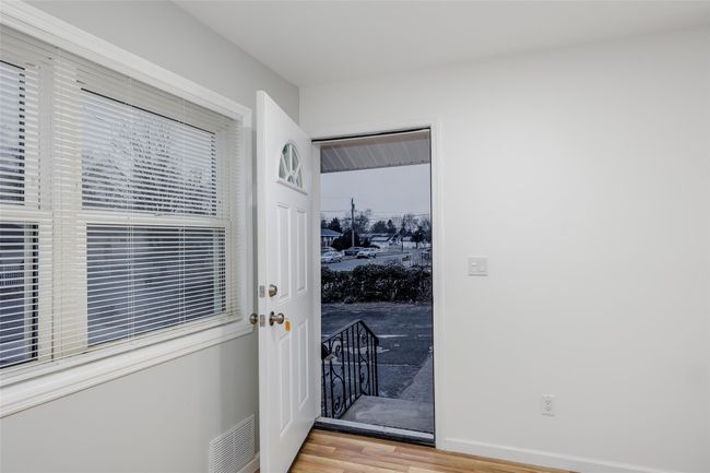 Doorway to outside featuring wood-type flooring | Image 7