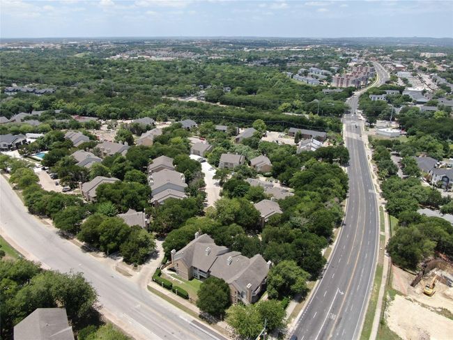 Aerial perspective of suburban area featuring a main thoroughfare | Image 31