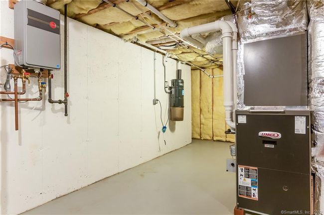 Utility/storage; 28' x 19'. Note the tankless hot water heater and the central vacuum. | Image 38