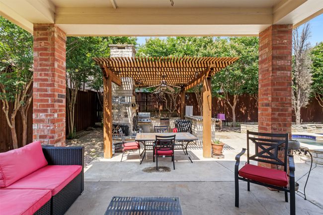 Fenced backyard with outdoor dining space, a pergola, and a patio | Image 37