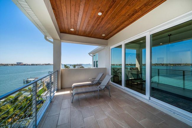 Primary Bedroom balcony, bring you coffee and watch the incredible sunrises. | Image 49