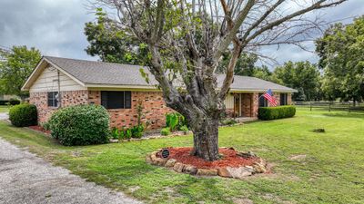 Ranch-style house featuring a front lawn | Image 2