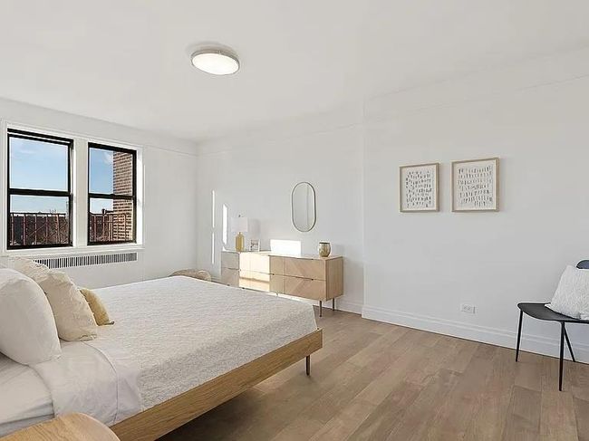 Bedroom featuring wood finished floors and baseboards | Image 5