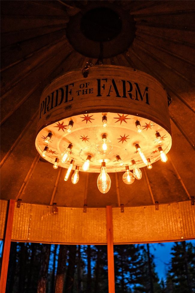 The silos make for a fun, peaceful entertainment area have custom UL certified light fixtures, all from slavaged and restores farm implements. They are an unexpected delight every time you look up. | Image 42
