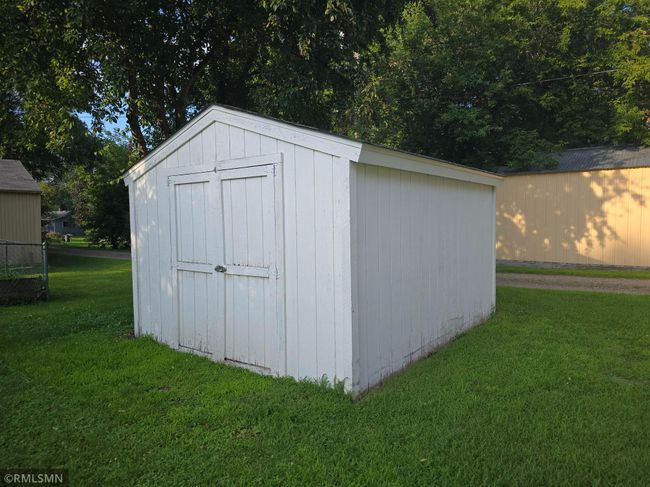 The 12x10 storage shed was built in 2000 and offers an enclosed space for a lawnmower, garden tools, and more. | Image 28
