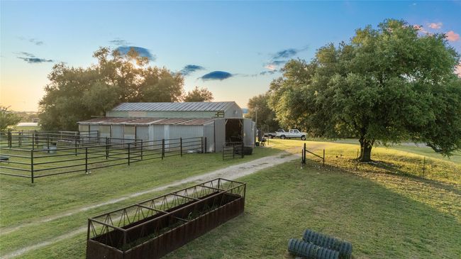 View of community featuring an outbuilding, an exterior structure, and driveway | Image 33