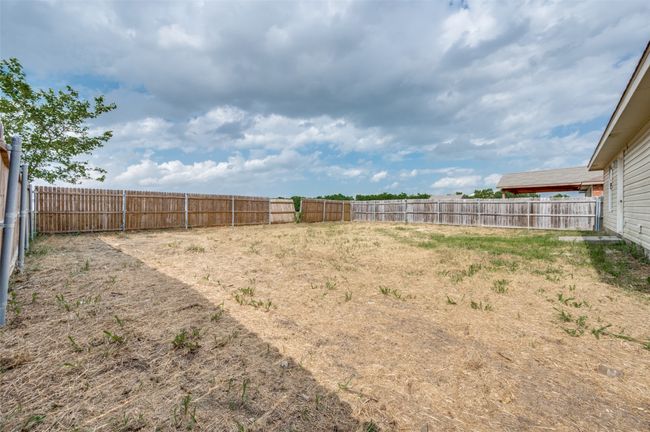 View of fenced backyard | Image 24
