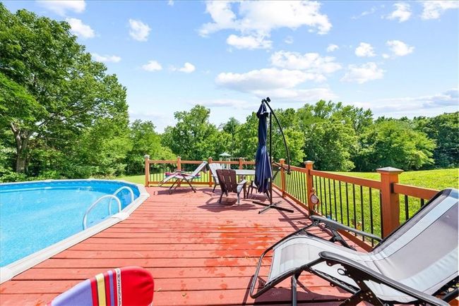 Wooden deck with an outdoor pool | Image 27