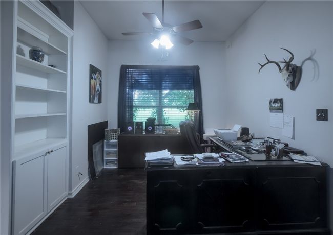 Office space featuring a ceiling fan and dark wood-style flooring | Image 22