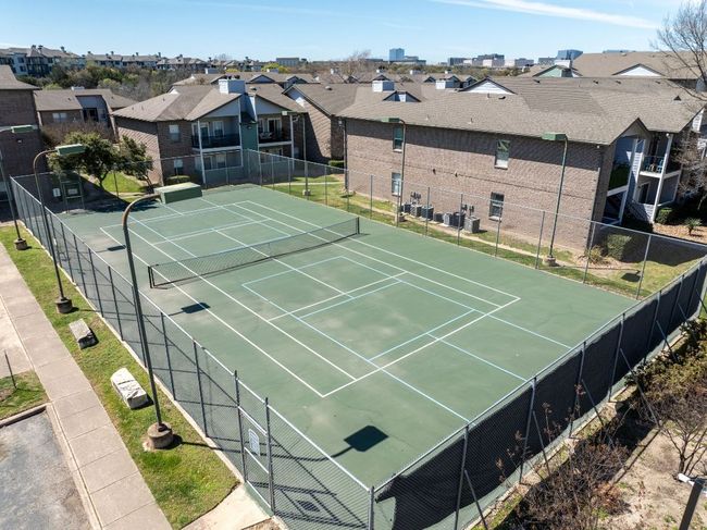 View of sport court featuring a residential view and fence | Image 26