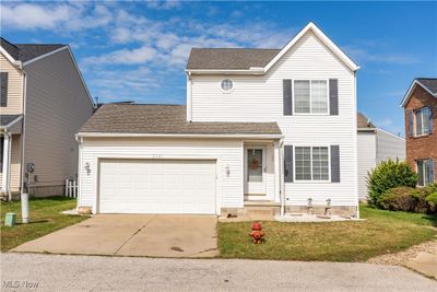 Front of property with a front lawn and a garage | Image 1