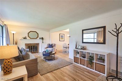 Living room with a textured ceiling and hardwood / wood-style floors | Image 2