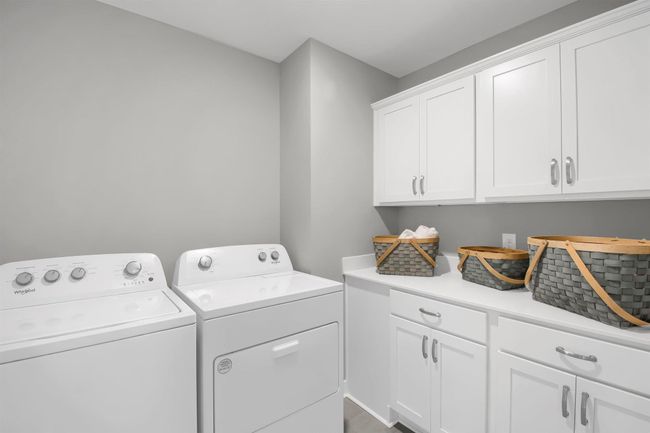 Bedroom level laundry with optional cabinets. Model photos. Options and colors will vary. | Image 32