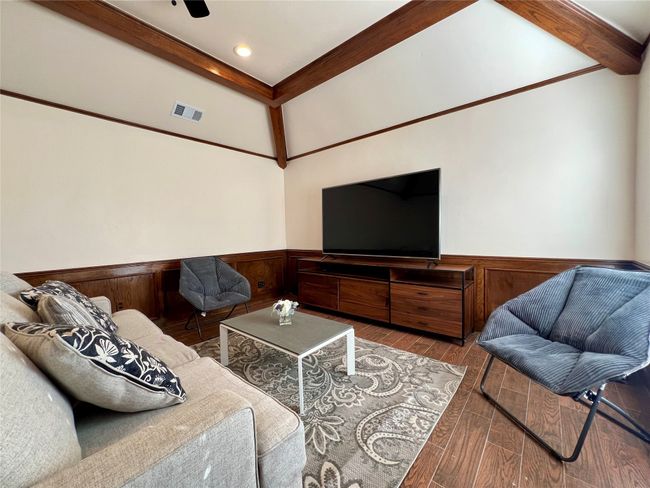 Living area featuring wainscoting, wood finished floors, beamed ceiling, and recessed lighting | Image 18