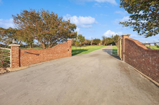 View of concrete surface featuring a gate | Image 12