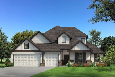 View of front facade with a front yard and a garage | Image 1