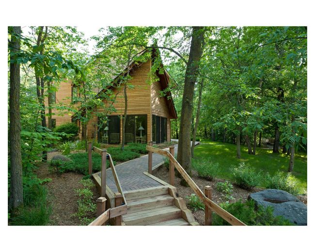 St. Anne is a cozy 3, 448 sq. ft. three bedroom, three and one-half bath home tucked away in the woods but only a few seconds golf cart ride from the beach and lake | Image 80