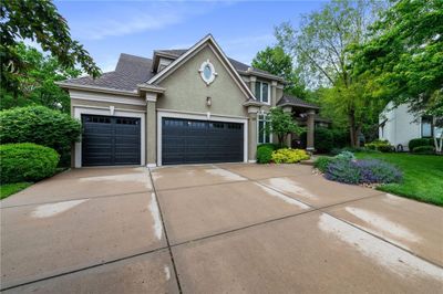 Front of property with a front lawn and a garage | Image 1