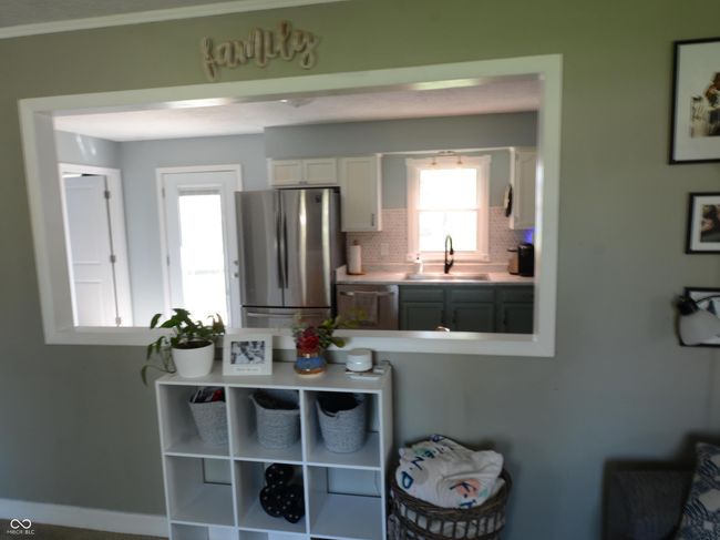 details with white cabinets, light countertops, backsplash, a sink, and appliances with stainless steel finishes | Image 10