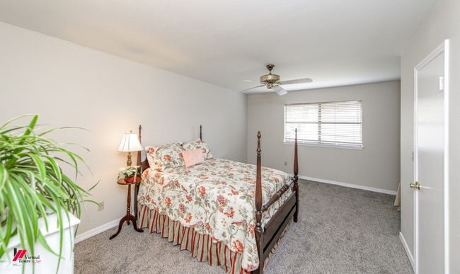 Carpeted bedroom featuring baseboards and a ceiling fan | Image 16