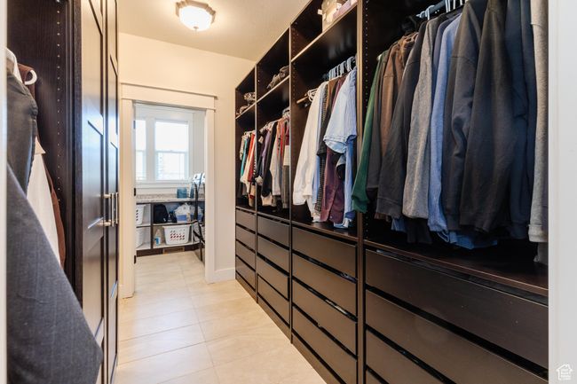Spacious closet with light tile patterned flooring | Image 25