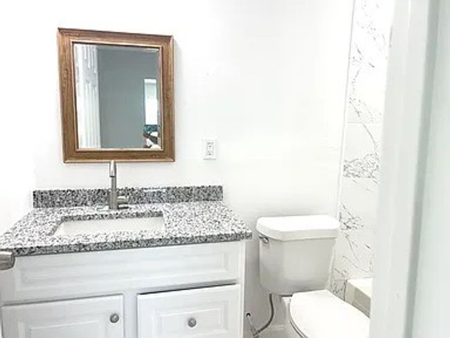 Full bathroom featuring vanity and toilet | Image 8