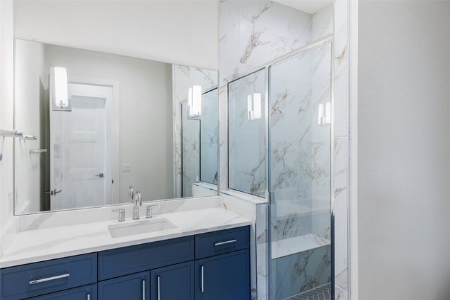 Bathroom 5 en-suite with vanity and a marble finish shower | Image 36