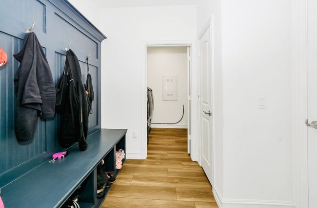Mudroom with light wood-style flooring and baseboards leading to Laundry Room | Image 5
