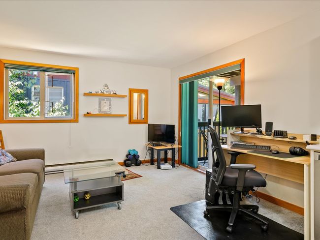Carpeted office space with plenty of natural light, baseboard heating, and baseboards | Image 22