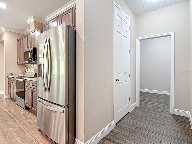 Kitchen, and Mud Room into Laundry Room | Image 22