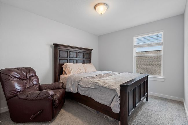 Bedroom featuring light carpet and baseboards | Image 31