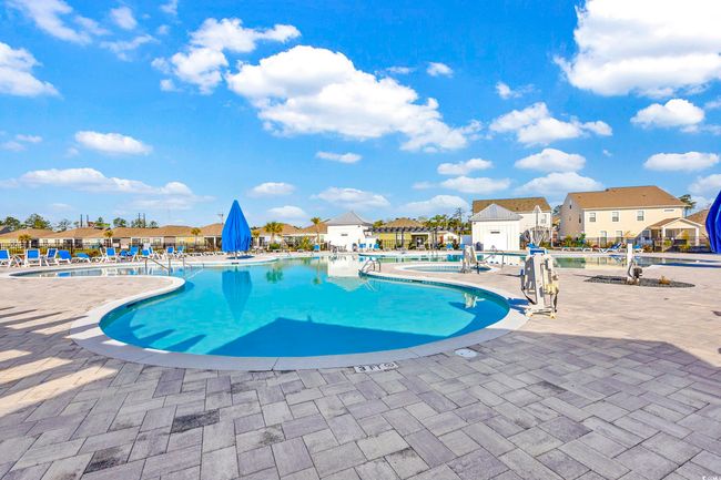 Community pool with a patio and a residential view | Image 34
