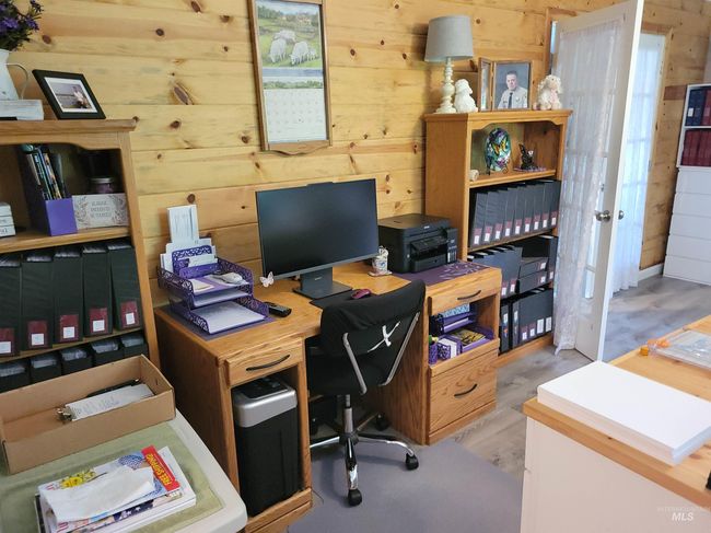 Office area featuring wood walls | Image 38