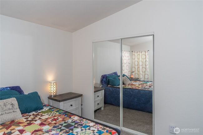 Closet in the bedroom and more in the bathroom area | Image 14