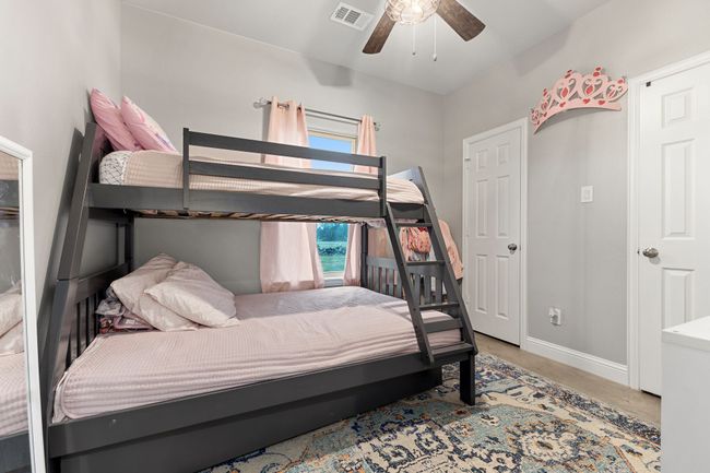 Bedroom featuring ceiling fan | Image 23