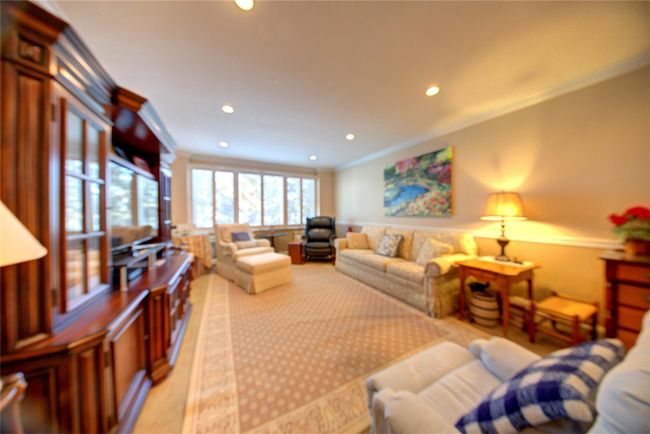 Living room with recessed lighting and crown molding | Image 12