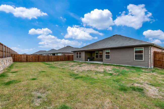 Back of house featuring a lawn and a patio area | Image 24