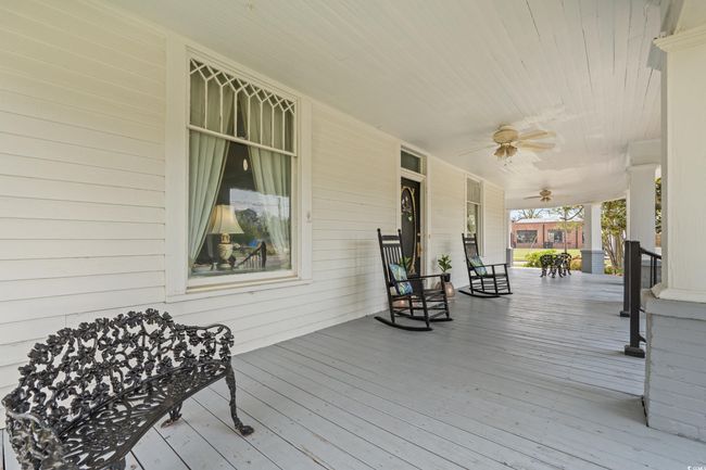 Wooden porch with a ceiling fan | Image 34