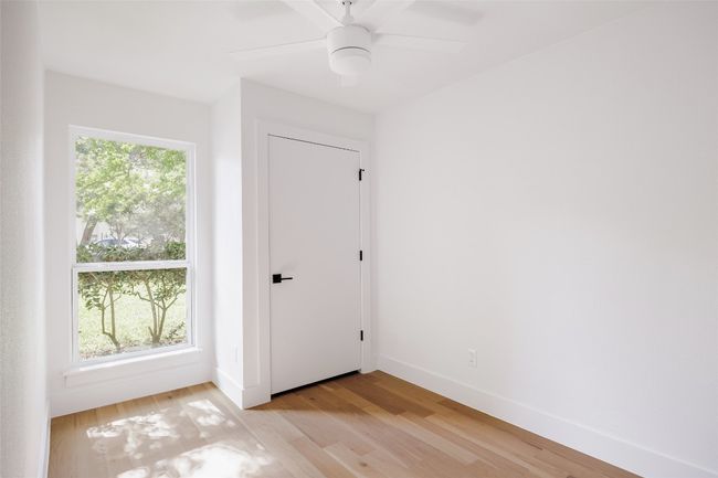 Spare room featuring light wood-style floors and ceiling fan | Image 29