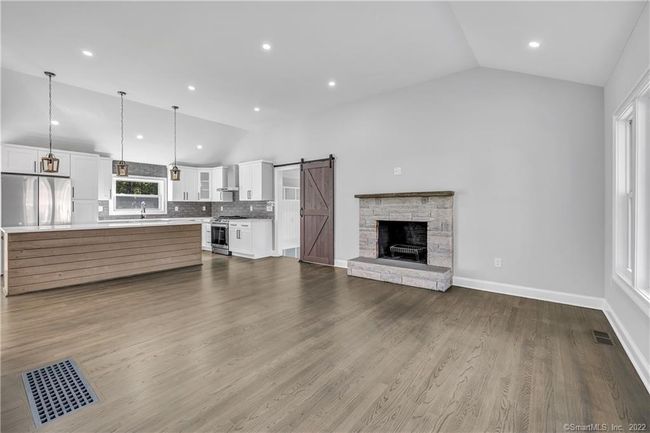 Gleaming hardwood floors flow through the main level. | Image 9