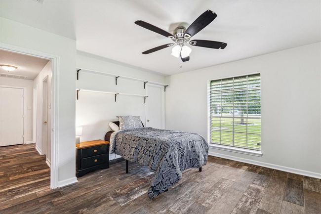 Third bedroom is spacious with walk-in closet and tiled flooring, there is an additional room that can be used as a 4th bedroom, office or flex space | Image 29