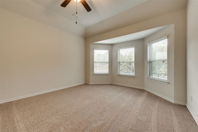 Unfurnished room with ceiling fan, light carpet, and vaulted ceiling | Image 11