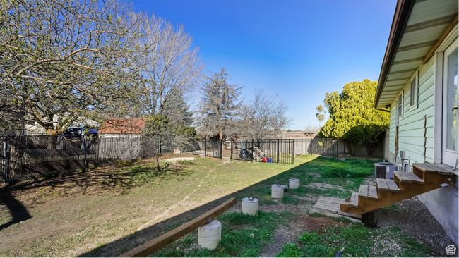 View of yard featuring a fenced backyard | Image 26