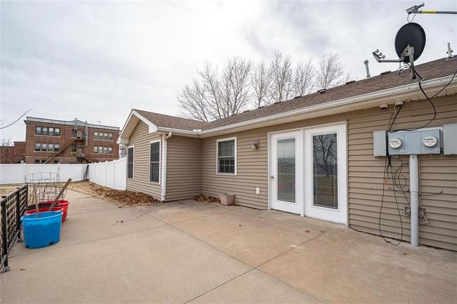 Rear view of property with a patio and fence | Image 42