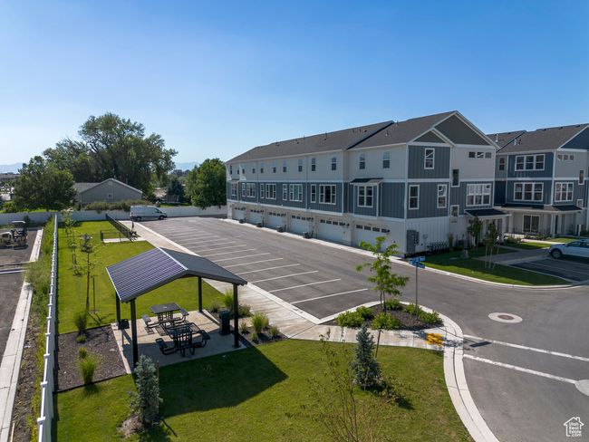 Uncovered parking lot with community garages and a residential view | Image 21