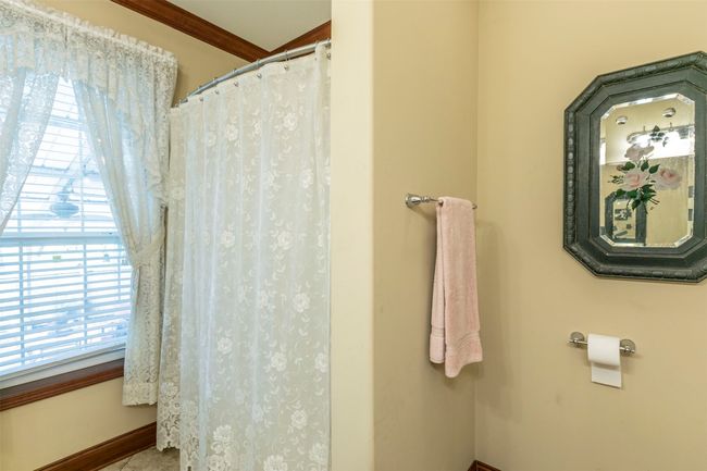 Full bath featuring baseboards and a shower with shower curtain | Image 20