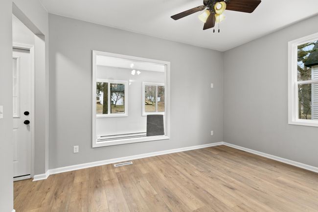 A view of the living room overlooking the front porch. | Image 11