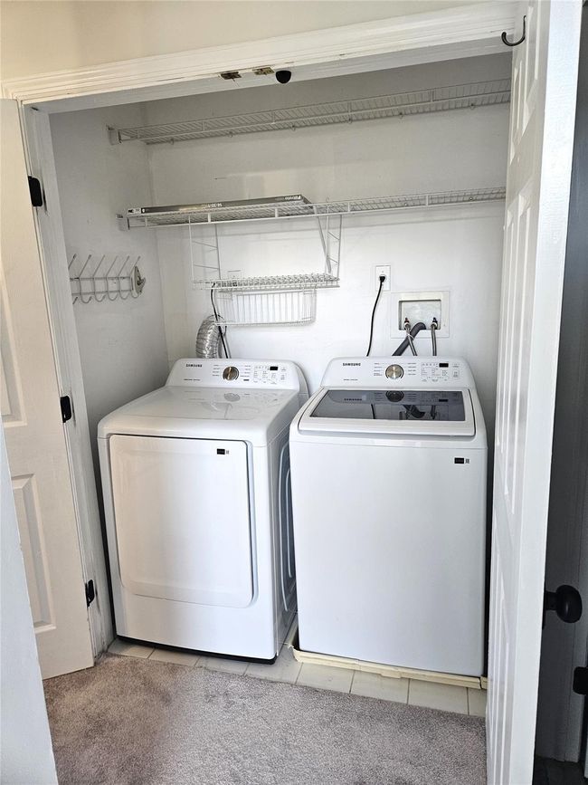 In The Hallway To The Guest Bedroom & Bathroom, Double Doors Lead To A Brand New Full Sized Samsung Washer & Dryer. | Image 14